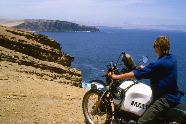 Wilma Allan, around the world trip, sitting on motorbike beside the Peruvian Coast PanAm highway